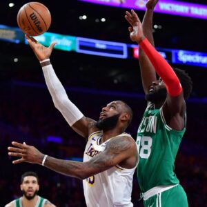 Los Angeles Lakers forward LeBron James (23) shoots ahead of Boston Celtics center Neemias Queta (88) during the first half at Crypto.com Arena.