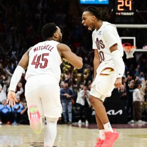 Cleveland Cavaliers guard Donovan Mitchell (45) and guard Darius Garland (10) celebrate after Mitchell made a three point basket during the second half against the Oklahoma City Thunder at Rocket Mortgage FieldHouse.