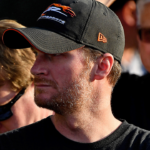 Feb 16, 2019; Daytona Beach, FL, USA; NASCAR Xfinity Series car owner Dale Earnhardt Jr. looks on from victory lane as his driver Michael Annett (not pictured) celebrates winning the NASCAR Racing Experience 300 at Daytona International Speedway. Mandatory Credit: Jasen Vinlove-Imagn Images