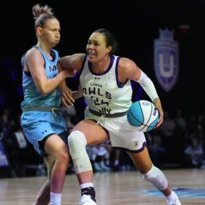 Napheesa Collier (24) of the Lunar Owls drives toward the basket as Courtney Vandersloot (25) of the Mist defends during the first half of the Unrivaled women’s professional 3v3 basketball league at Wayfair Arena