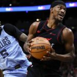 Miami Heat forward Jimmy Butler (22) drives to the basket against Memphis Grizzlies guard Vince Williams Jr. (5) during the second quarter at Kaseya Center