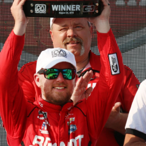 Justin Allgaier raises the trophy he won high at the Johnsonville 180, Saturday, August 25, 2018 at Elkhart Lake's Road America. 082518 She Johnsonville 180 Gk 01