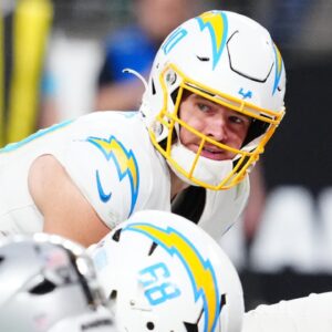 Jan 5, 2025; Paradise, Nevada, USA; Los Angeles Chargers quarterback Justin Herbert (10) looks to snap the ball against the Las Vegas Raiders during the fourth quarter at Allegiant Stadium.