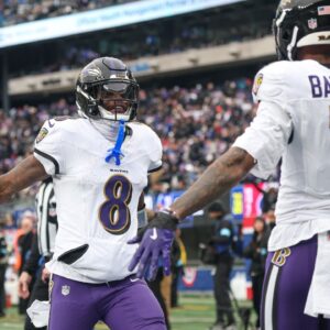 Baltimore Ravens quarterback Lamar Jackson (8) and wide receiver Rashod Bateman (7) celebrates after a touchdown pass during the first half against the New York Giants at MetLife Stadium.