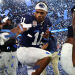 Penn State Nittany Lions defensive end Abdul Carter (11) reacts with teammates after defeating the Boise State Broncos in the Fiesta Bowl at State Farm Stadium.