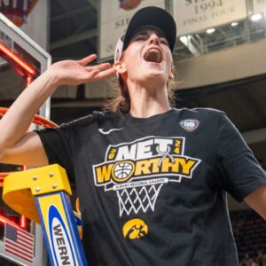 Iowa Hawkeyes guard Caitlin Clark (22) cuts down the net after beating LSU in the Elite 8 round of the NCAA Women's Basketball Tournament between Iowa and LSU at MVP Arena, Monday, April 1, 2024 in Albany, N.Y.
