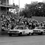 Driver Nelson Stacy in on the bumper of another driver in the ARCA 300-lap model race at the Fairgrounds Speedway on May 17, 1964. Stacy went on to finishes second behind winner Jack Bowsher before a crowd of 6,000.