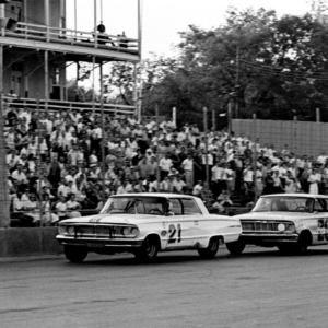 Driver Nelson Stacy in on the bumper of another driver in the ARCA 300-lap model race at the Fairgrounds Speedway on May 17, 1964. Stacy went on to finishes second behind winner Jack Bowsher before a crowd of 6,000.