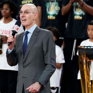 NBA commissioner Adam Silver presents the trophy to the Milwaukee Bucks after they won the Emirates NBA Cup championship game against the Oklahoma City Thunder at T-Mobile Arena