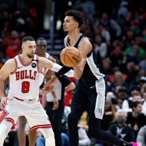 San Antonio Spurs center Victor Wembanyama (1) passes the ball against Chicago Bulls guard Zach LaVine (8) during the second half at United Center.