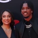 Washington Commanders quarterback Jayden Daniels and his mother Regina Jackson arrive on the red carpet before the 2024 ESPYS at Dolby Theatre.