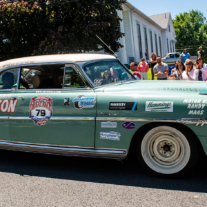Driver Neil Socquet from Westlake Village, CA, drives a 1952 Hudson Hornet down Clinton street along with his navigators during the Great Race stop in Montgomery, NY on Sunday, June 19, 2022. Ekmgreatrace19