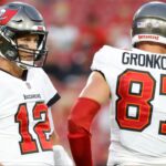 Tampa Bay Buccaneers quarterback Tom Brady (12) and tight end Rob Gronkowski (87) looks on against the Cincinnati Bengals during the first quarter at Raymond James Stadium.