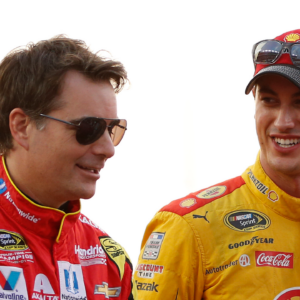 NASCAR Cup Series driver Jeff Gordon (88) talks to driver Joey Logano (22) during driver introductions prior to during the Federated Auto Parts 400 at Richmond International Raceway.