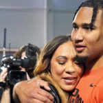 Ohio State quarterback C.J. Stroud hugs his mother, Kim, after his workout on the Buckeyes' pro day. CJ Stroud