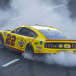NASCAR Cup Series driver Joey Logano celebrates with a burnout after winning the Busch Light Clash at The Coliseum at Los Angeles Memorial Coliseum.