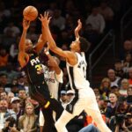 Phoenix Suns forward Kevin Durant (35) against San Antonio Spurs center Victor Wembanyama (1) in the first half of an NBA Cup game at Footprint Center