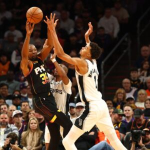 Phoenix Suns forward Kevin Durant (35) against San Antonio Spurs center Victor Wembanyama (1) in the first half of an NBA Cup game at Footprint Center