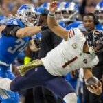 Nov 19, 2023; Detroit, Michigan, USA; Chicago Bears quarterback Justin Fields (1) runs with the ball and is pushed out of bounds by Detroit Lions linebacker Alex Anzalone (34) during the second half at Ford Field.