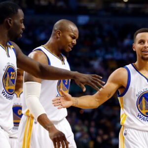 Golden State Warriors guard Stephen Curry (30) and Golden State Warriors forward Draymond Green (23) celebrate with Golden State Warriors forward David West (3) during the second half of the Golden State Warriors 104-88 win over the Boston Celtics at TD Garden