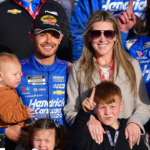 NASCAR Cup Series driver Kyle Larson (5) poses for photos with his family and crew following his victory of the Pennzoil 400 at Las Vegas Motor Speedway.
