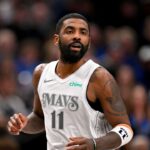 Dallas Mavericks guard Kyrie Irving (11) runs back up the court during the second half against the Minnesota Timberwolves at the American Airlines Center