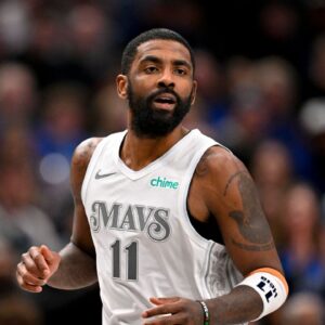 Dallas Mavericks guard Kyrie Irving (11) runs back up the court during the second half against the Minnesota Timberwolves at the American Airlines Center