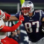 Oct 14, 2018; Foxborough, MA, USA; New England Patriots tight end Rob Gronkowski (87) makes a catch and stiff arms Kansas City Chiefs free safety Ron Parker (38) in the second half at Gillette Stadium. The Patriots defeated Kansas City 43-40.