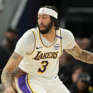 Los Angeles Lakers forward Anthony Davis (3) dribbles against Golden State Warriors guard Dennis Schroder (left) during the fourth quarter at Chase Center.