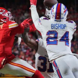 Kansas City Chiefs wide receiver Xavier Worthy (1) makes a catch against Buffalo Bills safety Cole Bishop (24) during the first half in the AFC Championship game at GEHA Field at Arrowhead Stadium.