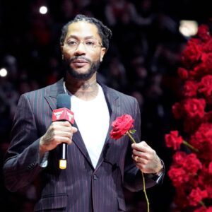 Chicago Bulls and New York Knicks former player Derrick Rose speaks as he is honored at halftime of a game between the Chicago Bulls and the New York Knicks at United Center