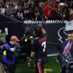 Jan 11, 2025; Houston, Texas, USA; Houston Texans quarterback C.J. Stroud (7) walks off the field after the win against the Los Angeles Chargers in an AFC wild card game at NRG Stadium.