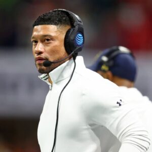 Notre Dame Fighting Irish head coach Marcus Freeman looks on against the Ohio State Buckeyes during the first half the CFP National Championship college football game at Mercedes-Benz Stadium.
