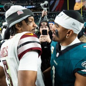 Nov 14, 2024; Philadelphia, Pennsylvania, USA; Philadelphia Eagles quarterback Jalen Hurts (1) and Washington Commanders quarterback Jayden Daniels (5) shake hands after an Eagles victory at Lincoln Financial Field.