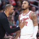 Houston Rockets head coach Ime Udoka talks with forward Cam Whitmore (7) during the third quarter against the Phoenix Suns at Toyota Center.