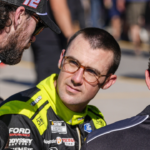 NASCAR Cup Series driver Ryan Blaney (12) talks with driver Austin Cindric (2) during cup qualifying at Martinsville Speedway.