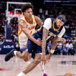 New Orleans Pelicans forward Brandon Ingram (14) dribbles around Atlanta Hawks forward Jalen Johnson (1) during the second half at Smoothie King Center