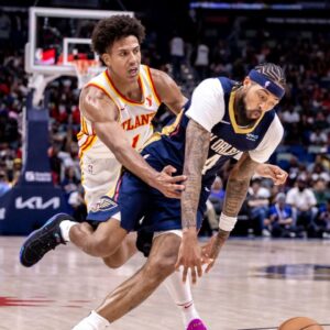 New Orleans Pelicans forward Brandon Ingram (14) dribbles around Atlanta Hawks forward Jalen Johnson (1) during the second half at Smoothie King Center