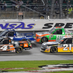 May 6, 2016; Kansas City, KS, USA; NASCAR Camping World Truck Series drivers Christopher Bell (4) and William Byron (9) race ahead of Johnny Sauter (21) and Daniel Hemric (19) during the Toyota Tundra 250 at Kansas Speedway. Mandatory Credit: Jasen Vinlove-Imagn Images