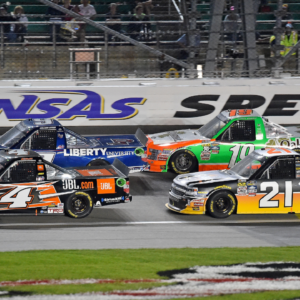 May 6, 2016; Kansas City, KS, USA; NASCAR Camping World Truck Series drivers Christopher Bell (4) and William Byron (9) race ahead of Johnny Sauter (21) and Daniel Hemric (19) during the Toyota Tundra 250 at Kansas Speedway. Mandatory Credit: Jasen Vinlove-Imagn Images