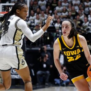Purdue Boilermakers guard Jayla Smith (3) defends Iowa Hawkeyes guard Caitlin Clark (22) during the NCAA women’s basketball game
