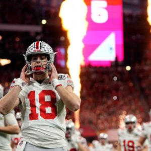 Ohio State Buckeyes quarterback Will Howard (18) take the field for the start of the game against Notre Dame Fighting Irish during the College Football Playoff National Championship at Mercedes-Benz Stadium in Atlanta on January 20, 2025.