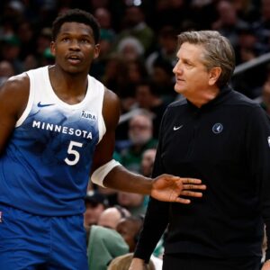 Minnesota Timberwolves head coach Chris Finch talks with guard Anthony Edwards (5) during the second quarter against the Boston Celtics at TD Garden.