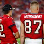 Tampa Bay Buccaneers quarterback Tom Brady (12) and tight end Rob Gronkowski (87) look on in the second half against the New York Giants at Raymond James Stadium.