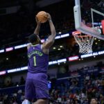 New Orleans Pelicans forward Zion Williamson (1) dunks against the Minnesota Timberwolves during the first half at Smoothie King Center.