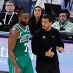 Boston Celtics head coach Joe Mazzulla talks to guard Jaylen Brown (7) on a break in play against the Oklahoma City Thunder during the third quarter at Paycom Center.