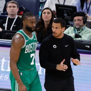 Boston Celtics head coach Joe Mazzulla talks to guard Jaylen Brown (7) on a break in play against the Oklahoma City Thunder during the third quarter at Paycom Center.
