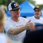 Dale Earnhardt Jr. talks to fans before the 16th Annual Hampton Heat at Langley Speedway.