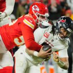 Jan 18, 2025; Kansas City, Missouri, USA; Houston Texans quarterback C.J. Stroud (7) is sacked by Kansas City Chiefs defensive end George Karlaftis (56) during the fourth quarter of a 2025 AFC divisional round game at GEHA Field at Arrowhead Stadium.
