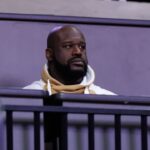 Former NBA player Shaquille O'Neal sits courtside during the first half between the Florida Gators and the LSU Tigers at Exactech Arena at the Stephen C. O'Connell Center.